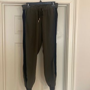 Lululemon olive green joggers with black velvet trim down the sides. Size 6.